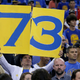 A Golden State Warriors fan holds up a 73 sign before an NBA basketball game between the Warriors and the Memphis Grizzlies in Oakland, Calif., Wednesday, April 13, 2016. The Warriors had 72 wins heading into their final regular-season game, the same number of wins as the 1995-1996 Chicago Bulls.